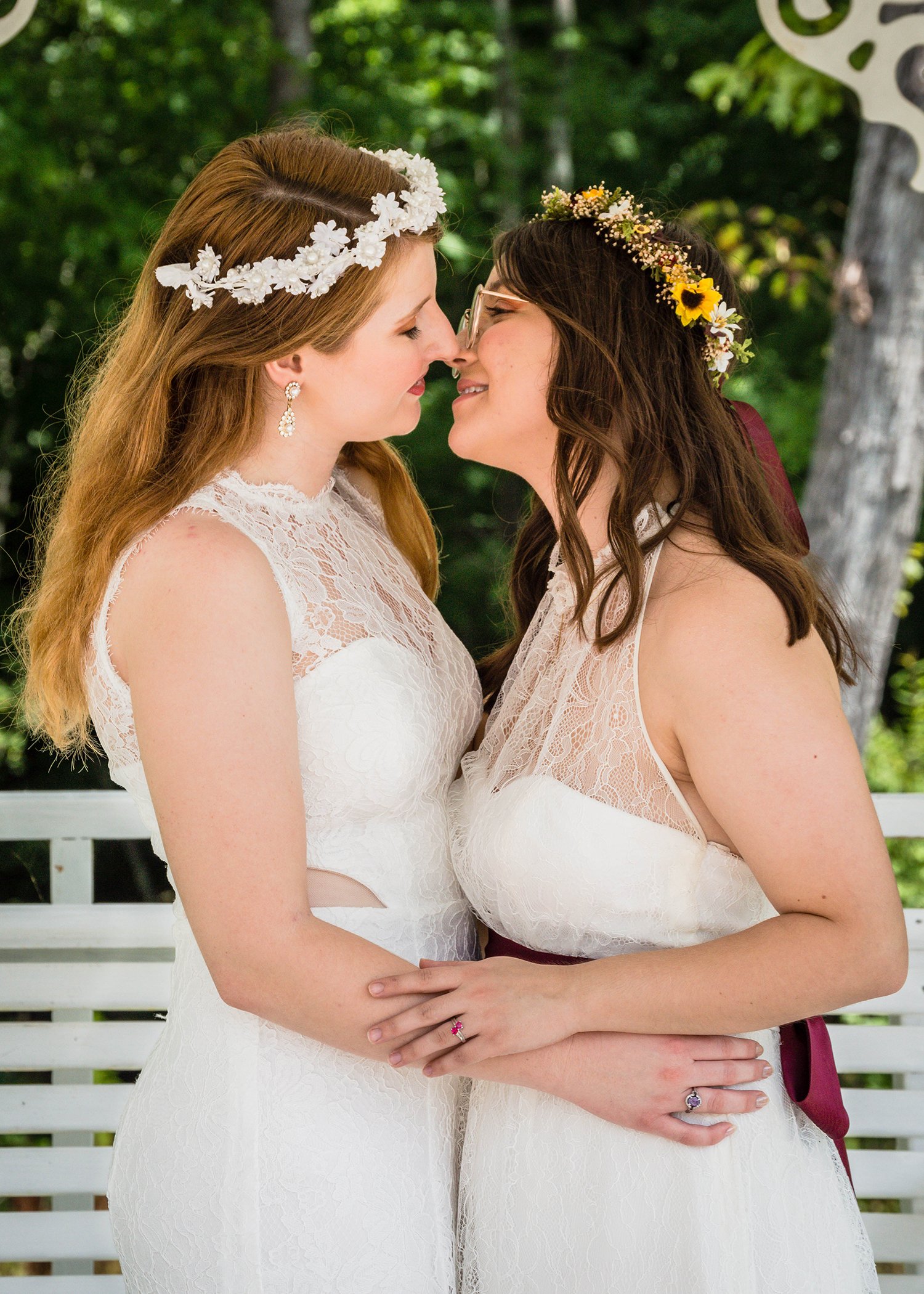 Two LGBTQ+ marriers sneak in another kiss.