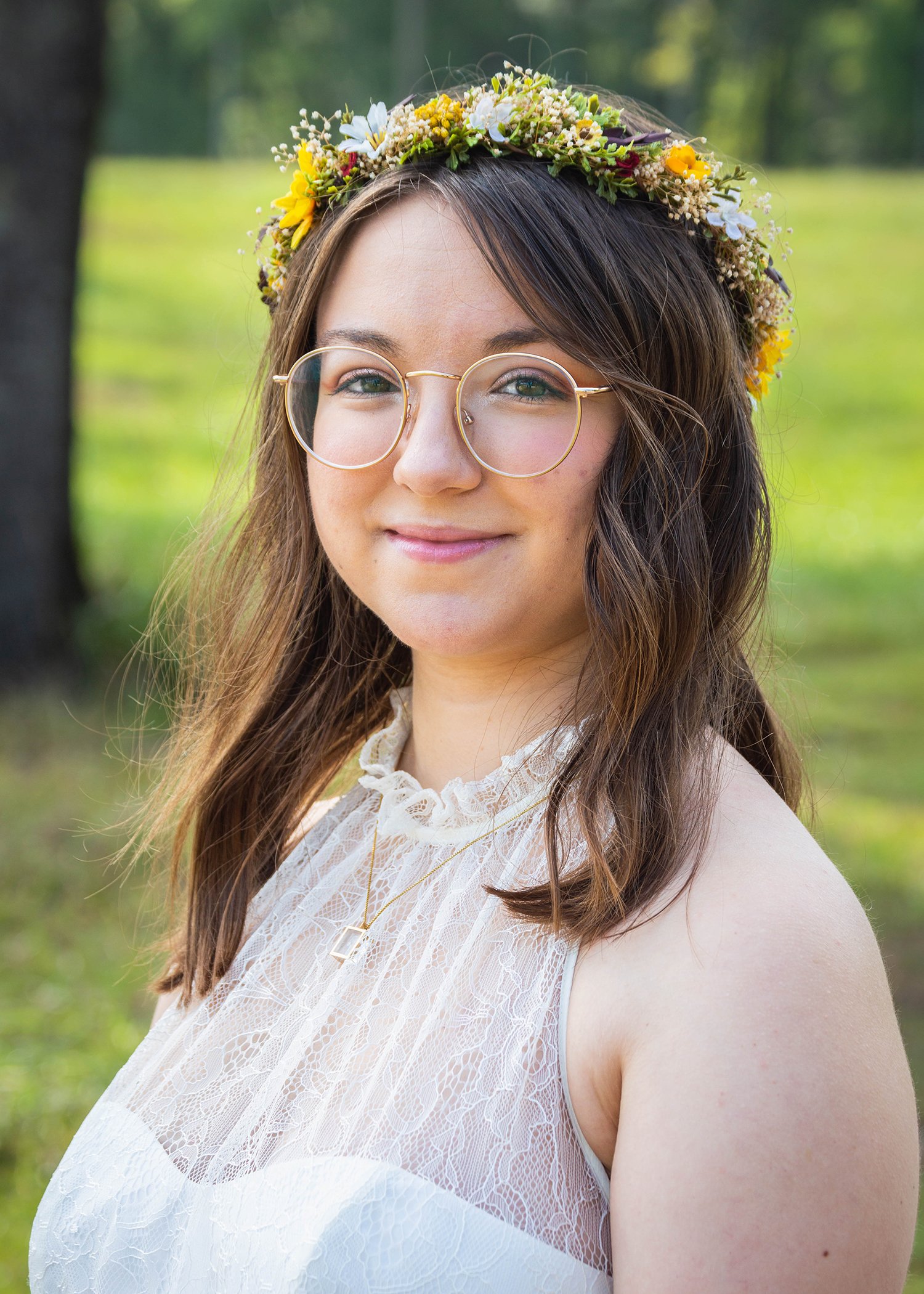 An LGBTQ marrier stands outside the wedding venue at Davidson Farm for bridal portraits.