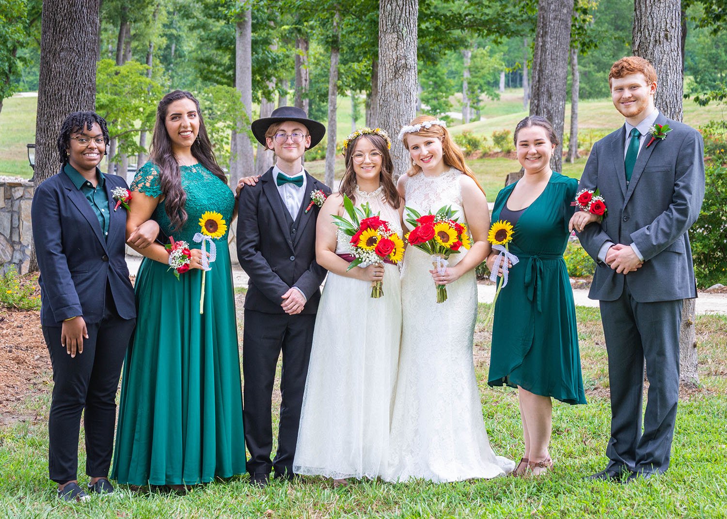 An uneven wedding party poses with spouses in South Carolina.