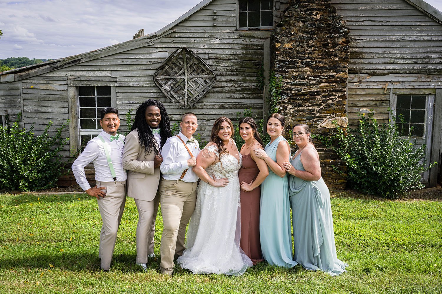 A wedding party poses with spouse at the Pavilion at Black Water Junction in Union Hall, Virginia.