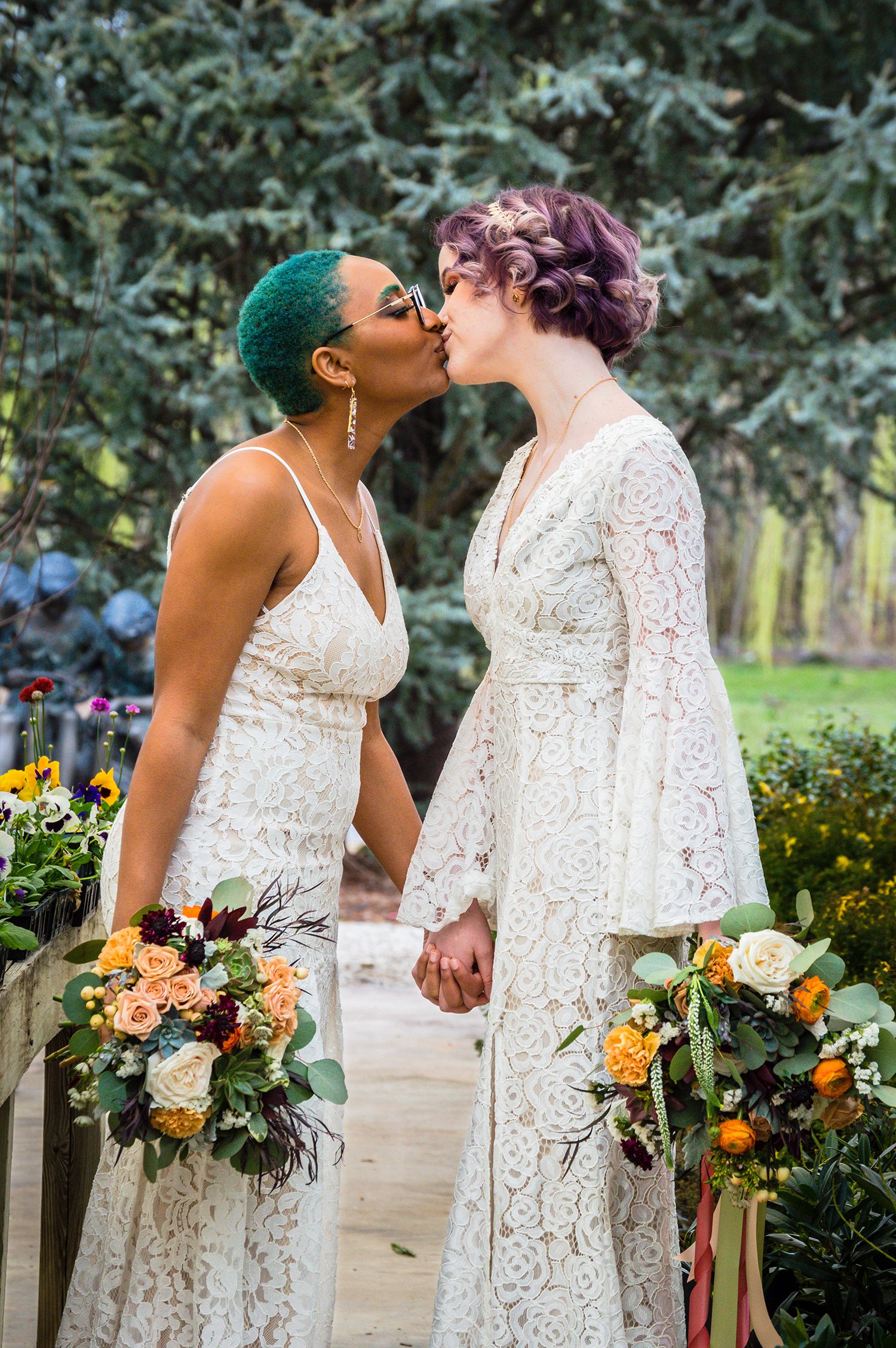 Model wedding partners kiss at a greenhouse elopement styled photoshoot in Virginia.