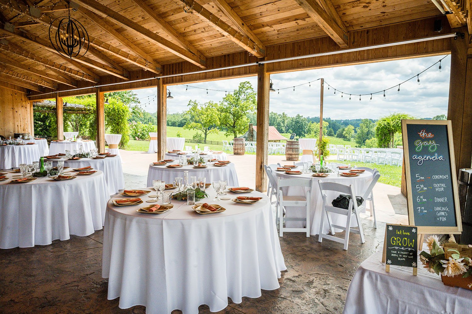 A wide shot of the Pavilion at Black Water Junction wedding venue photographed under the pavilion with table set up.