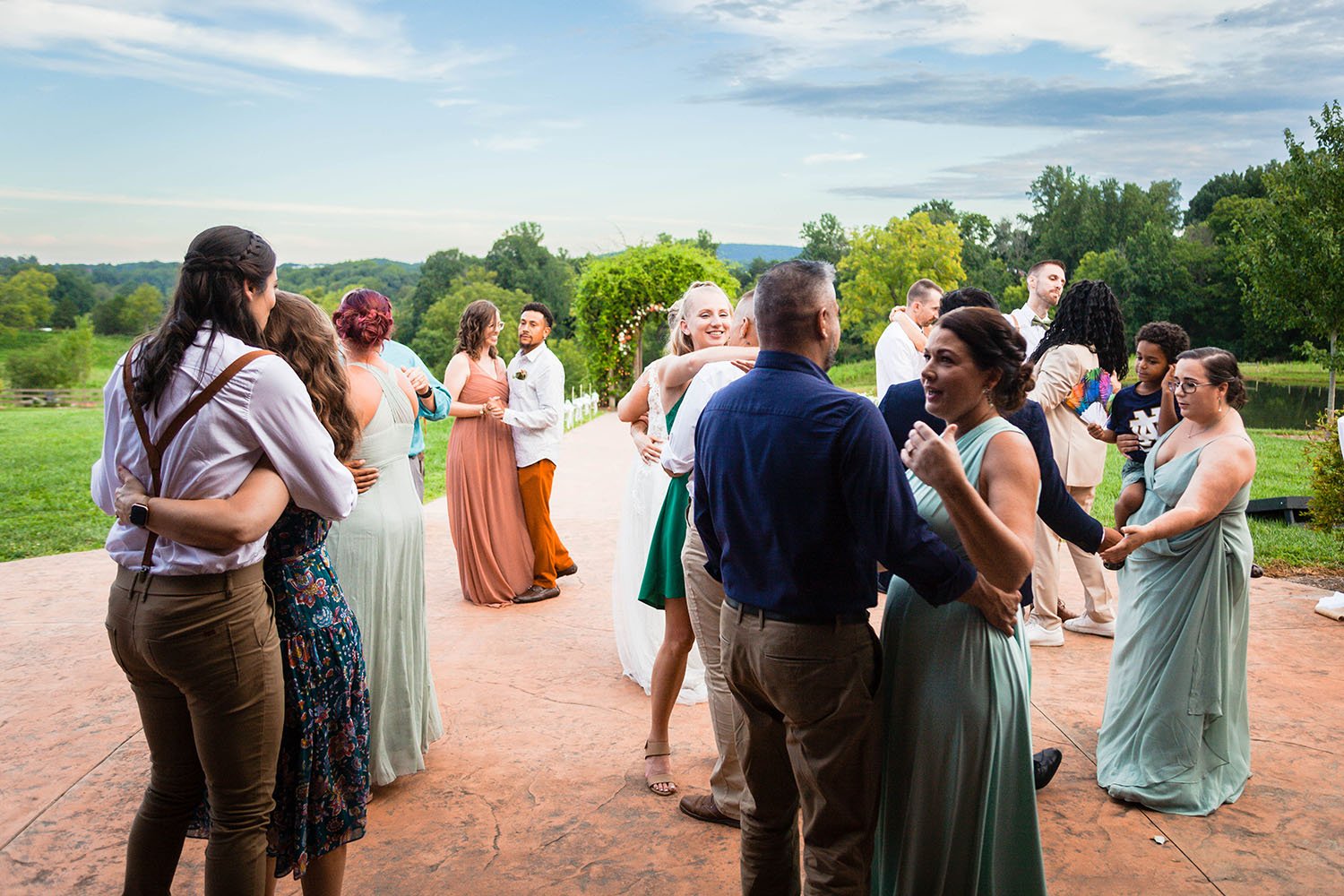 The dance floor at the Pavilion at Black Water Junction fills with various couples dancing as they join the newlywed couple for their first dance.