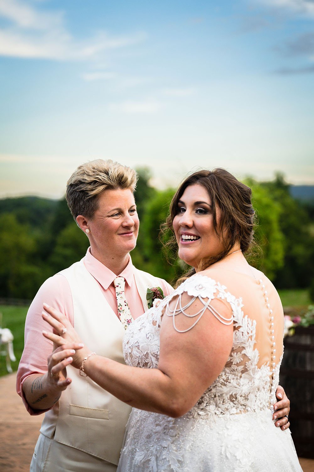 An lgbtq+ newlywed couple take to the dance floor for their first dance at the Pavilion at Black Water Junction.