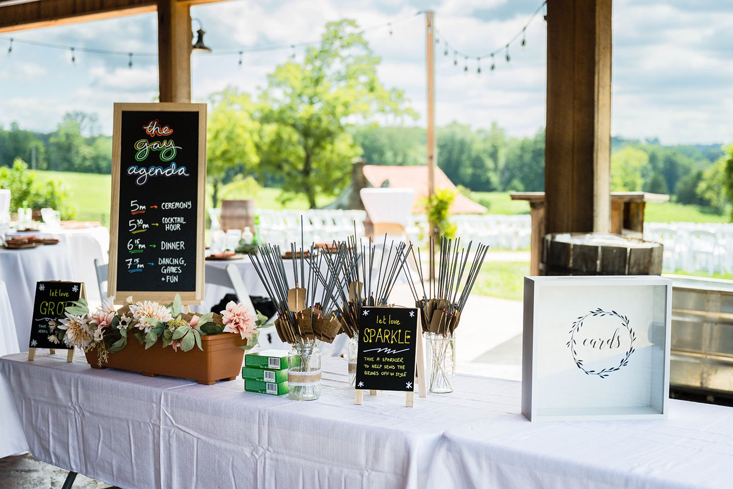 A table underneath a pavilion at the Pavilion at Black Water Junction, a wedding venue in Virginia.