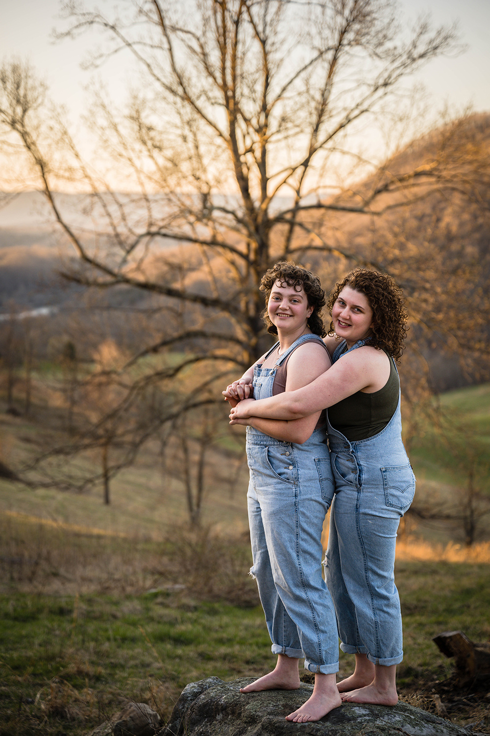 An LGBTQ+ couple embraces one another during their anniversary portrait session in Southwest Virgina.