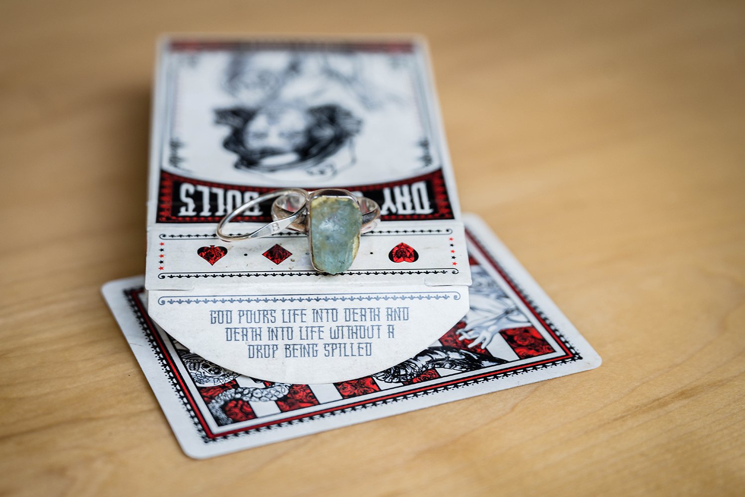 Wedding rings sit atop a freshly opened deck of cards at Olde Salem Brewing Company in Roanoke, Virginia.