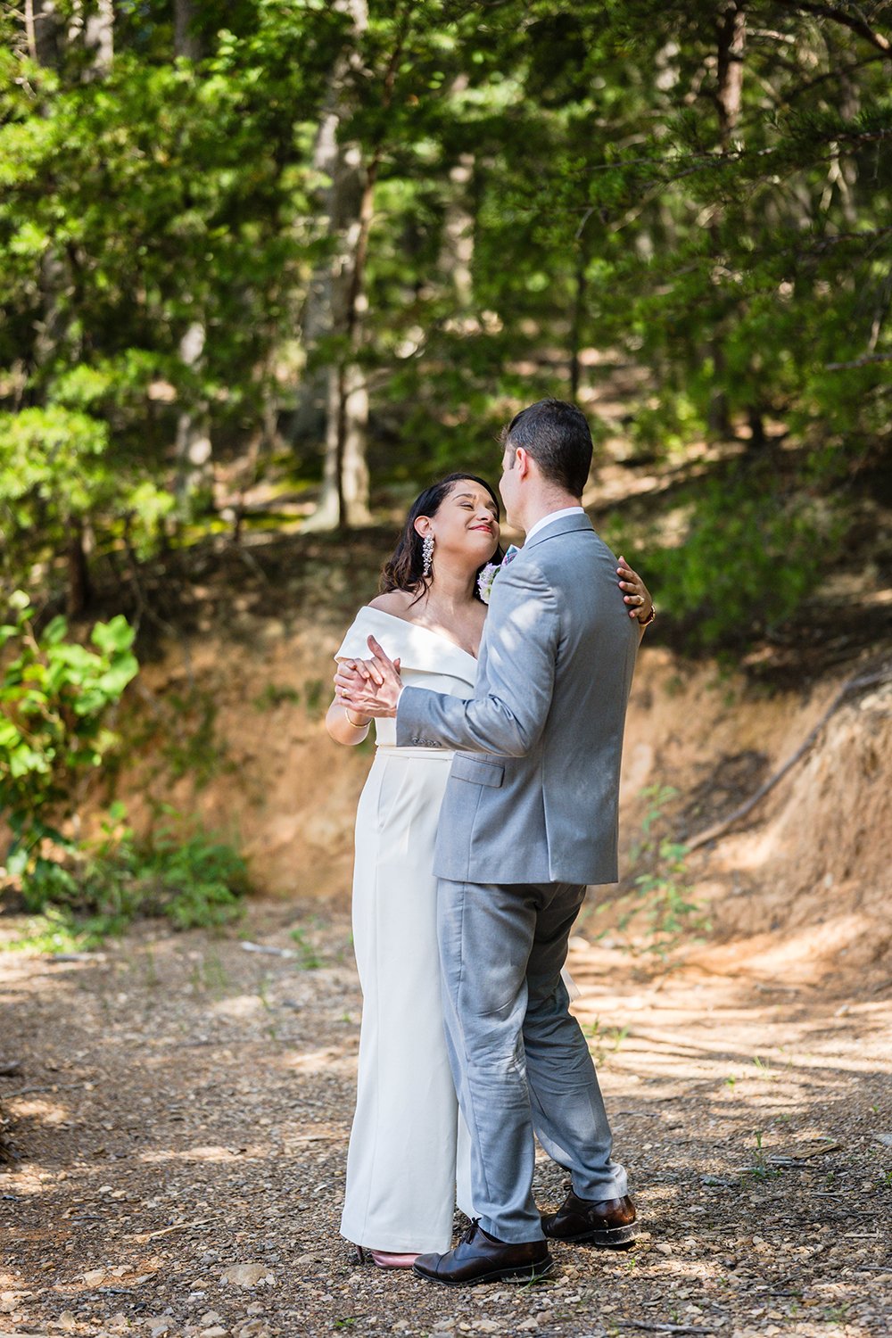 A newlywed couple takes their first dance during their elopement.