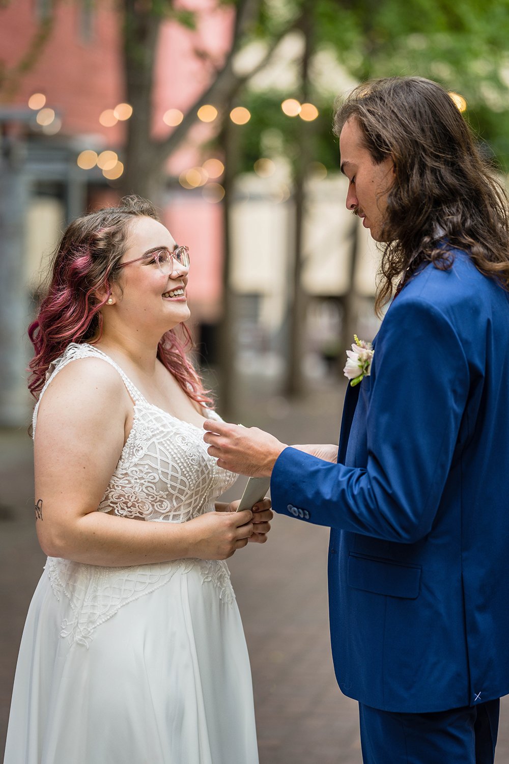 A bride and groom read their vows on their elopement day in Downtown Roanoke.