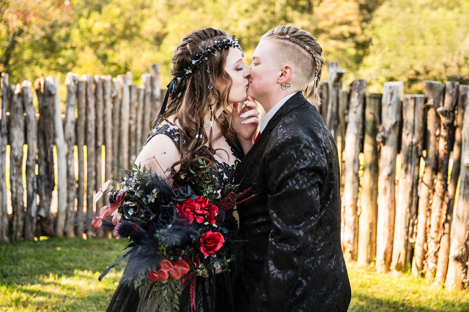 An LGBTQ+ wedding couple kiss after their first look reveal in the yard of a Roanoke Airbnb on their elopement day in Virginia.