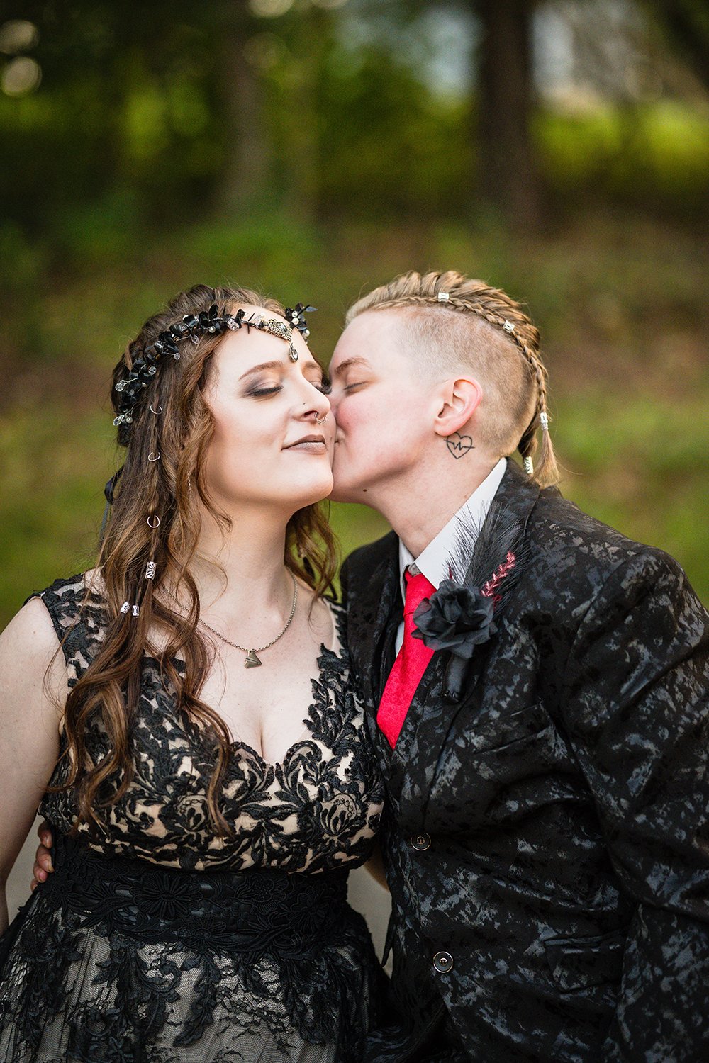 An LGBTQ+ marrier kisses their partner’s cheek on their elopement day at their Roanoke airbnb in Virginia.