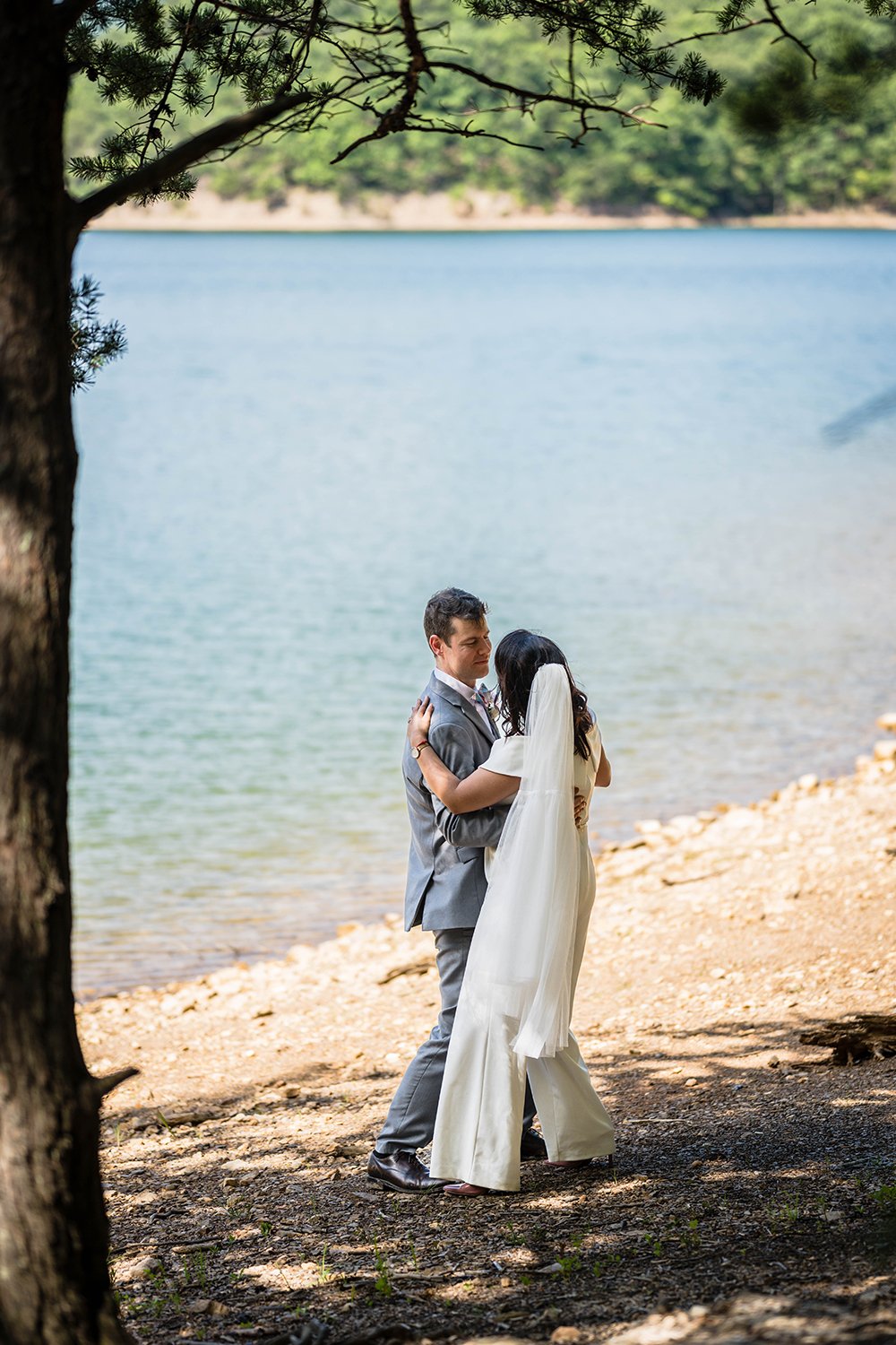 A wedding couple dances along the shores of Carvin's Cove on their elopement day.