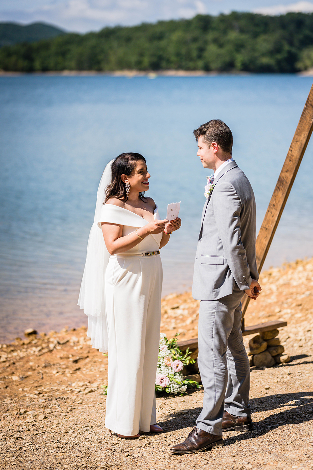 A couple read their vows to one another along the shores of Carvin's Cove in Roanoke, Virginia.