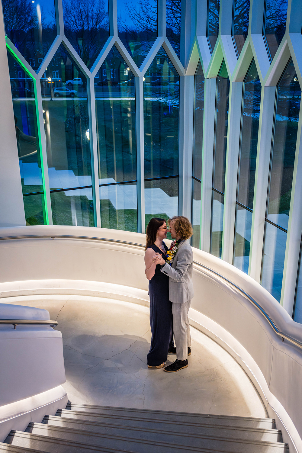 An elopement couple take their first dance on the stairwell of the Moss Arts Center.
