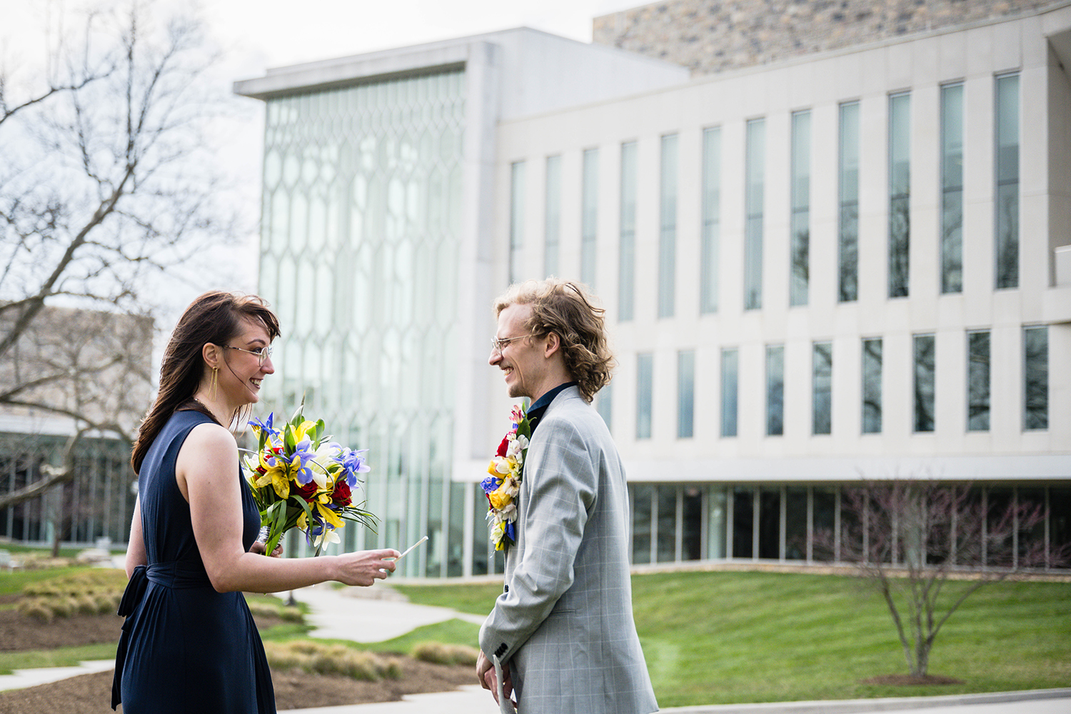 A bride and groom exchange their wedding vows outside of the Moss Arts Center on Virginia Tech's campus in Blacksburg, Virginia.