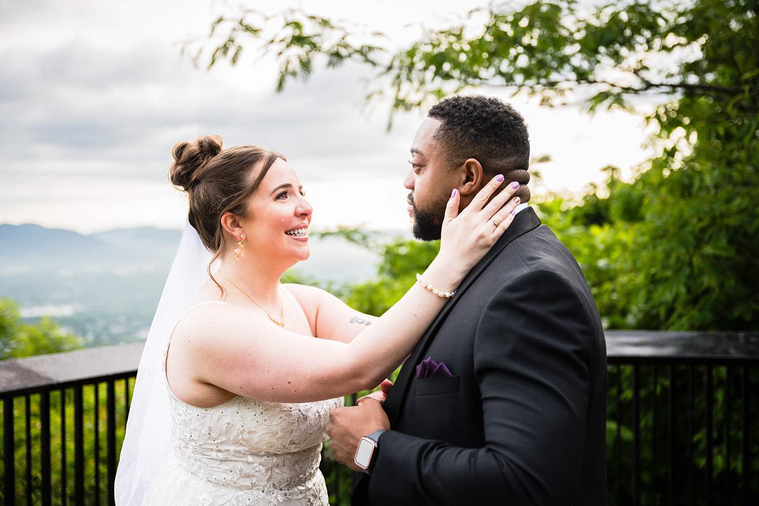 A couple looks at one another as tears roll down their face after their elopement ceremony at Mill Mountain Park in Roanoke, Virginia.