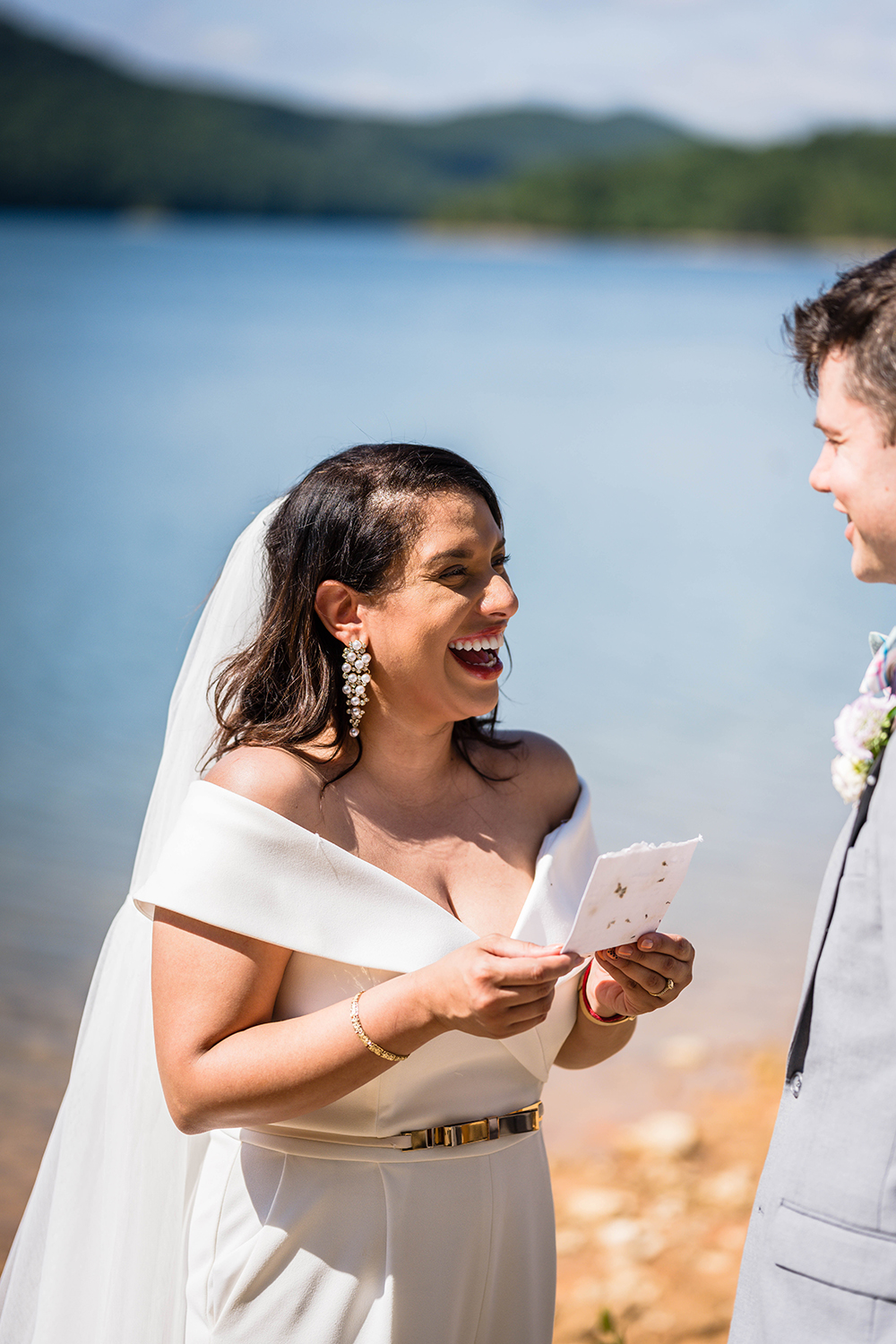 A marrier reads her vows during her and her partner's vow exchange along the Blue Ridge Parkway in Virginia.