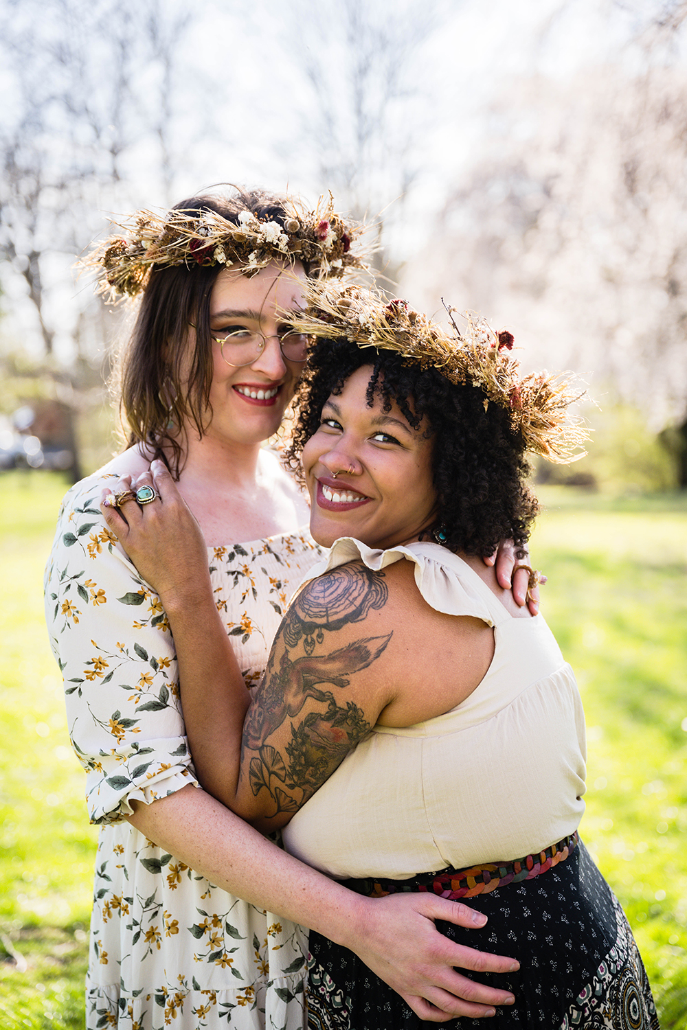 Two marriers hug one another during their first dance on their elopement day and smile towards the camera.