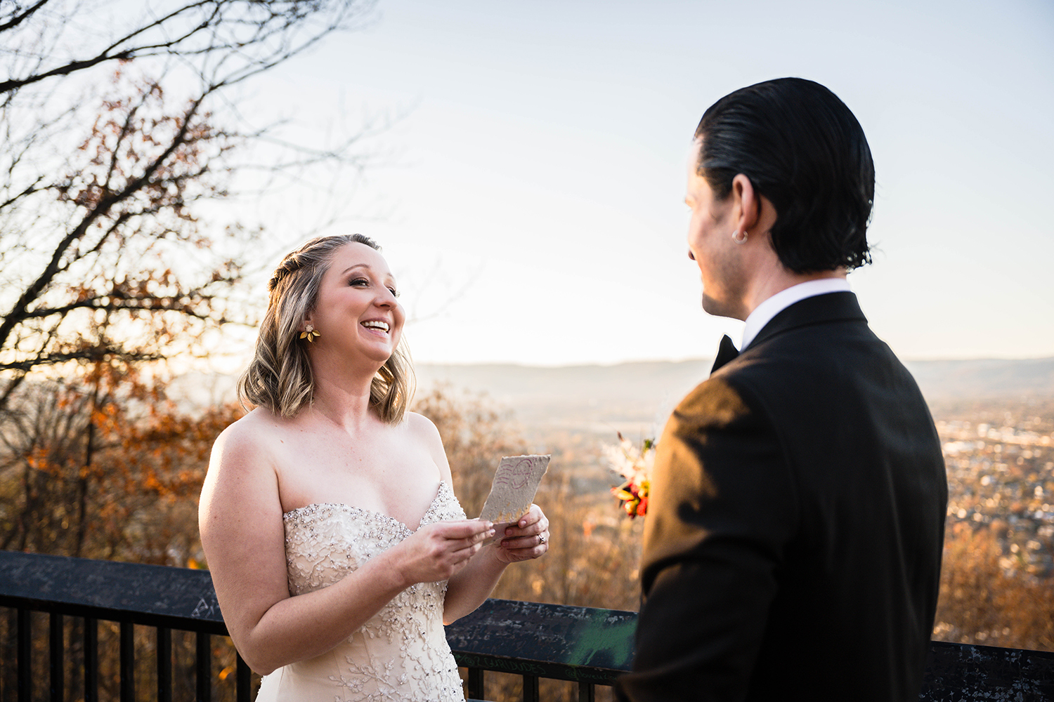 A couple read their vows to each other at the Rockledge Overlook during their elopement in Roanoke, VA.