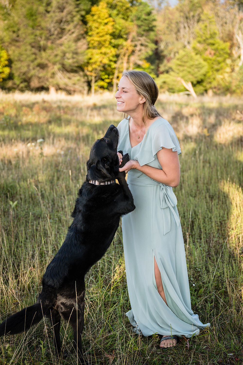 A bride gets ready with her dog out in a field at Tanner's Ridge Overlook.