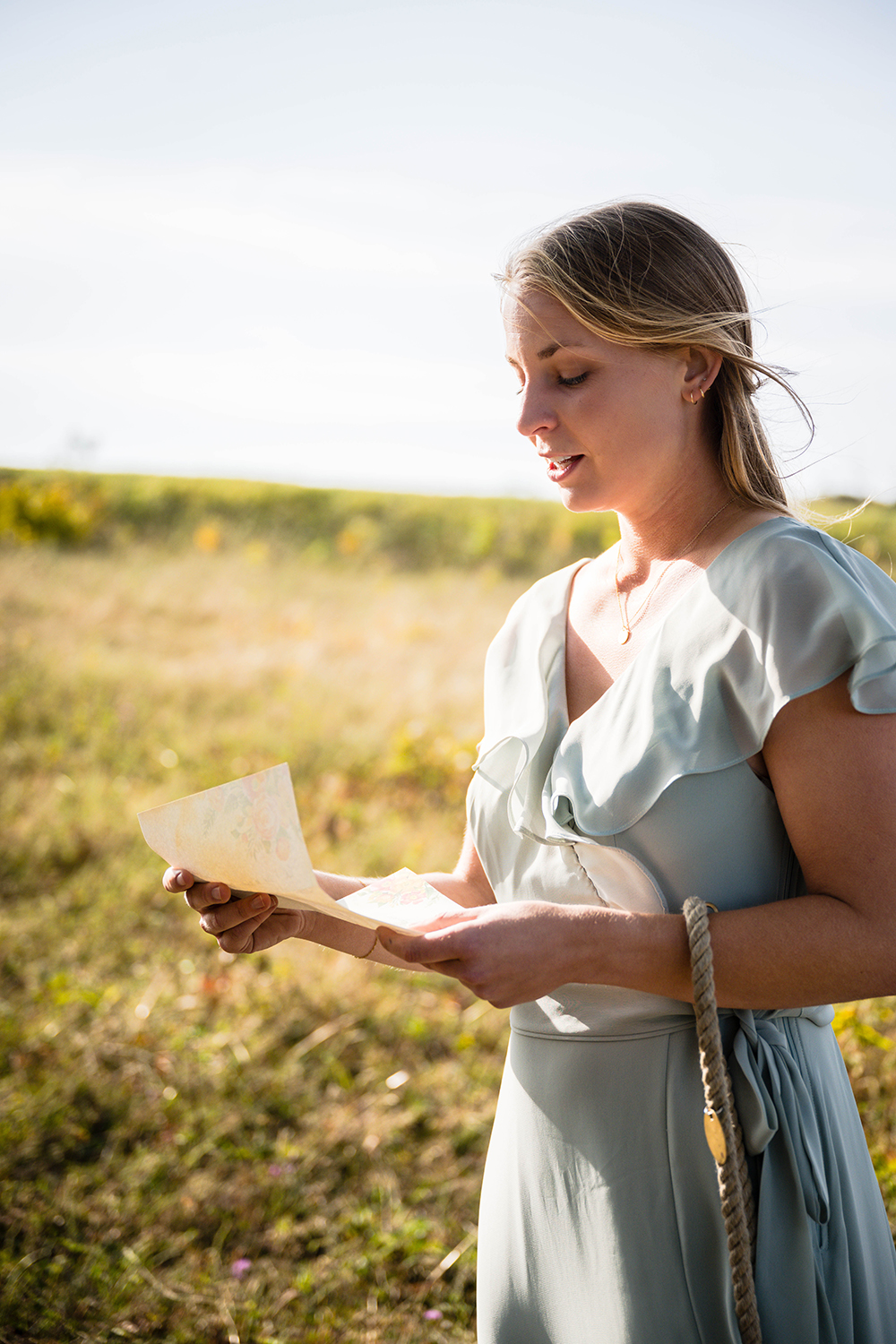 A bride reads her wedding vows during her elopement day at Tanner's Ridge Overlook in Shenandoah National Park.