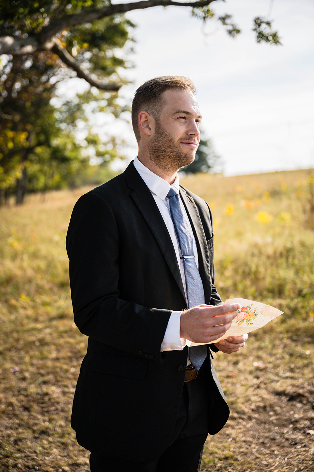 A groom reads his wedding vows on his elopement day at Tanner's Ridge Overlook in Shenandoah National Park in Virginia.