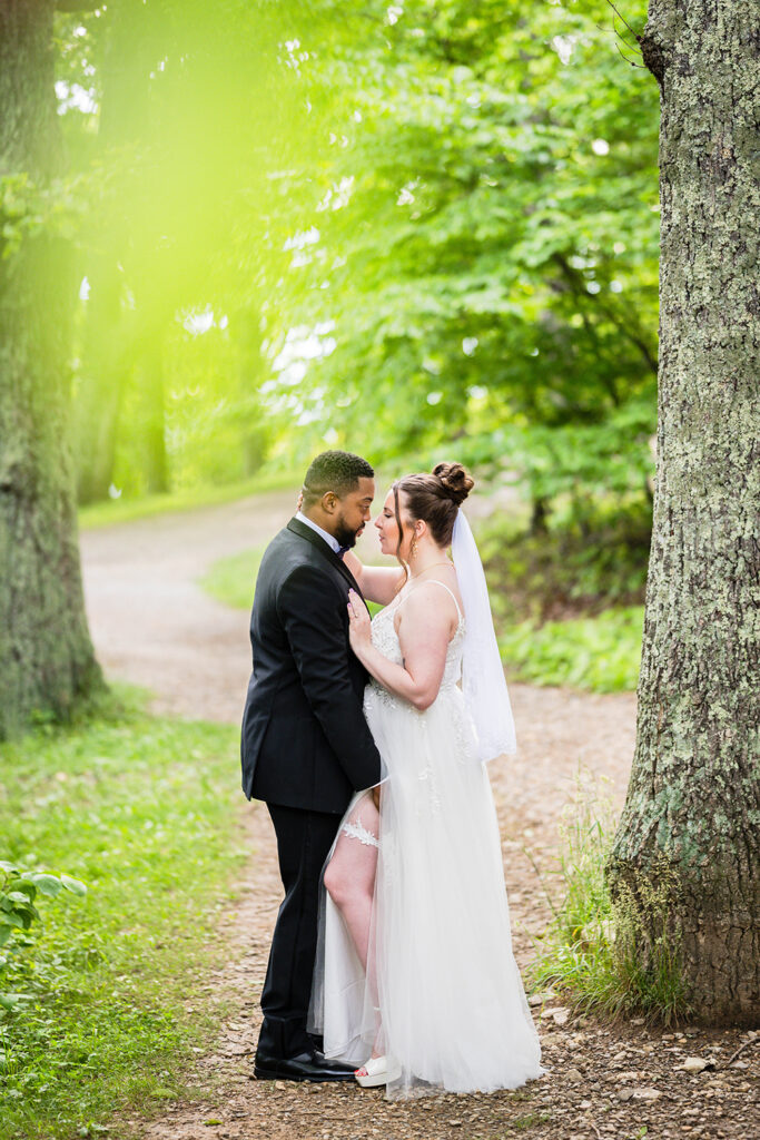 A couple on their elopement day in Virginia embrace one another.