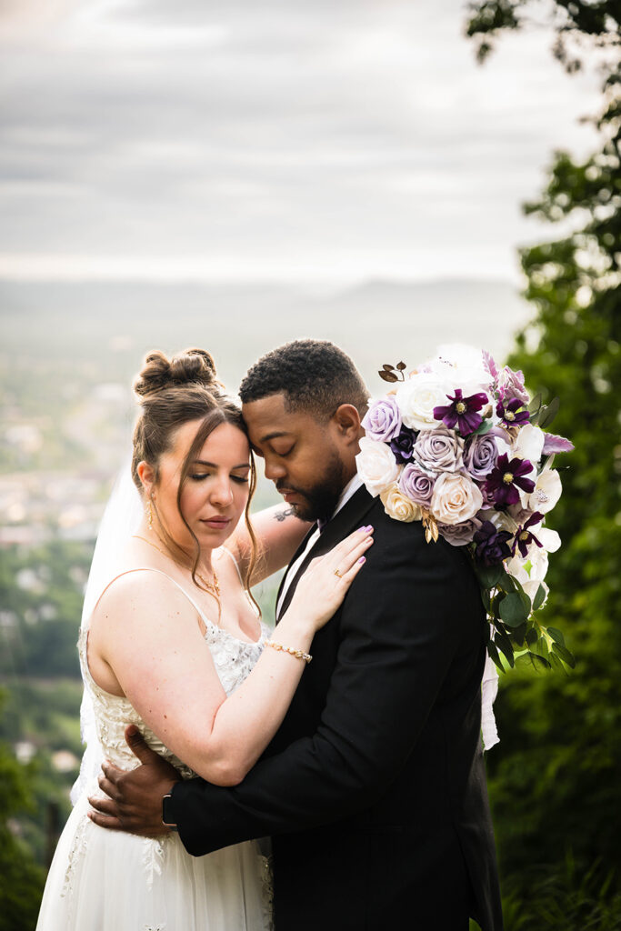 A couple on their elopement day in Virginia embrace one another.