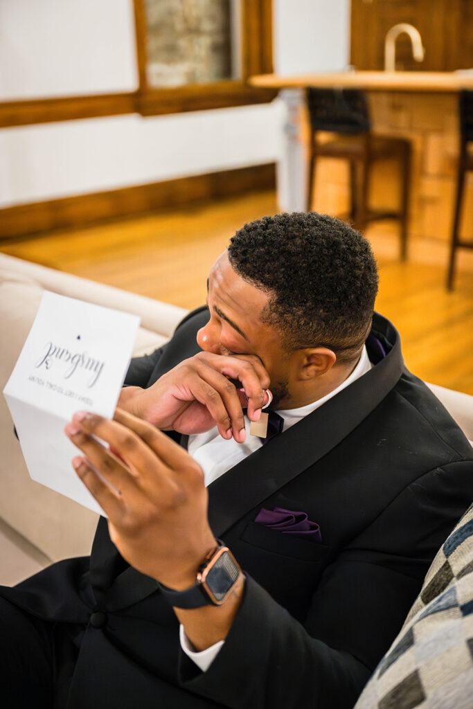 A man wipes away a tear as he reads a note left to him by his soon-to-be wife on his wedding day.