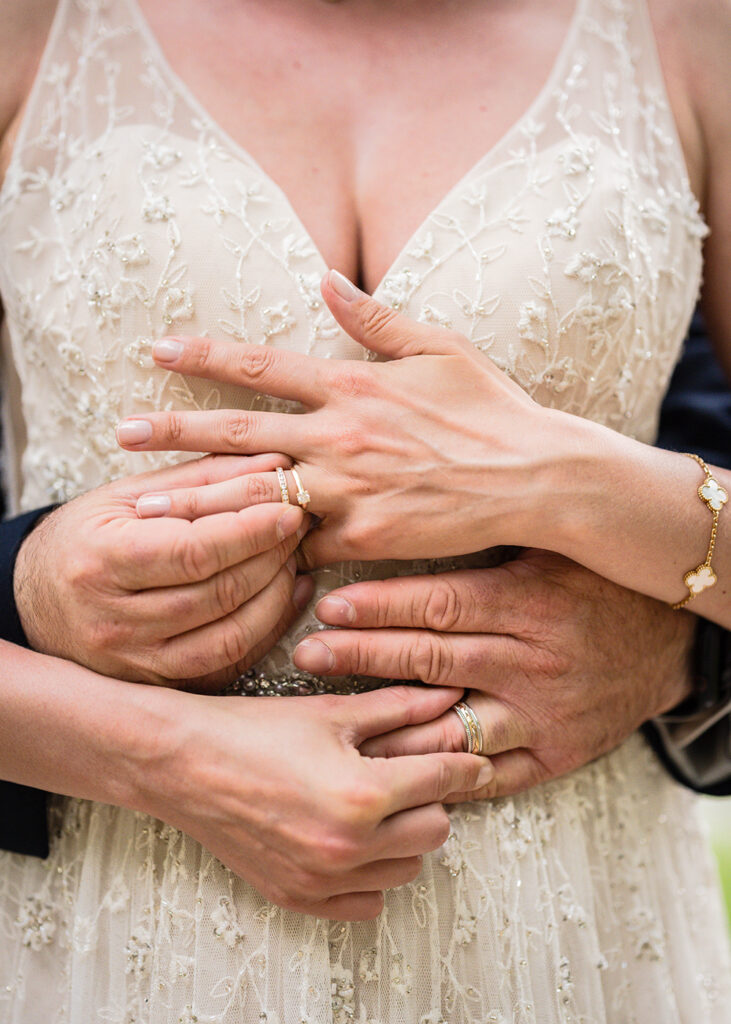 A close up shot of a couple exchanging rings on their wedding day.