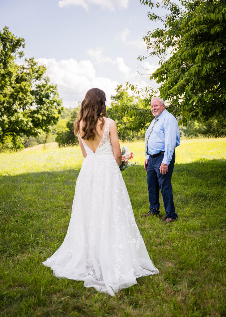 A bride has a first look with her Dad at Cahas Mountain Overlook in Virginia.
