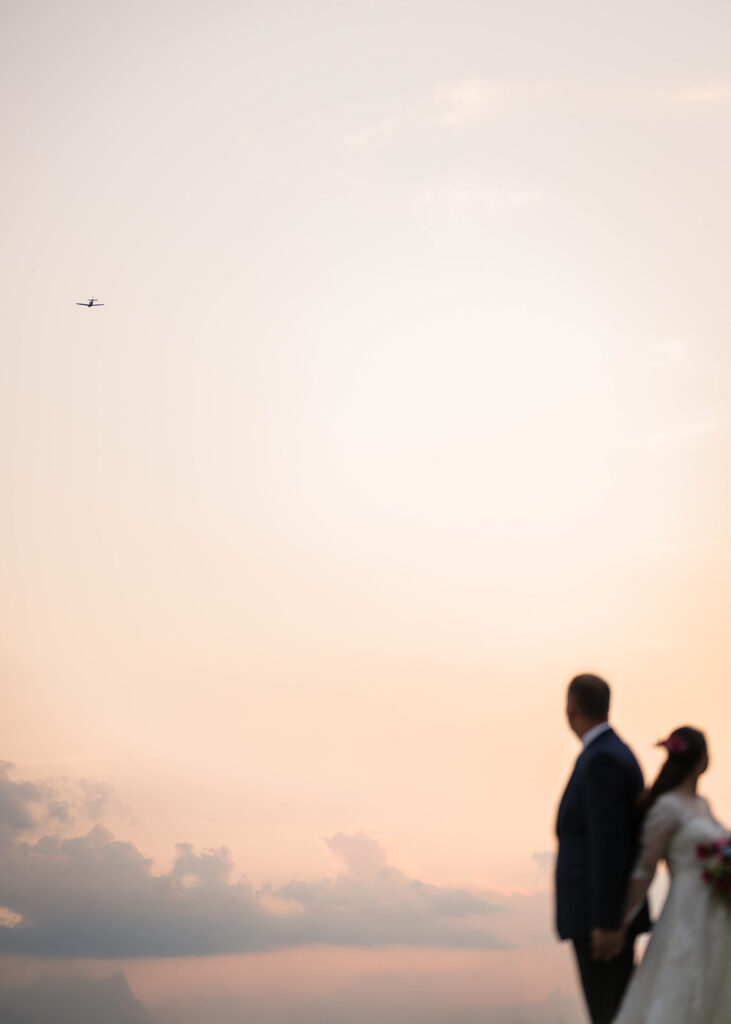 A small plane flies overhead during a couple's portrait session on their Martinsville, Virginia elopement day.