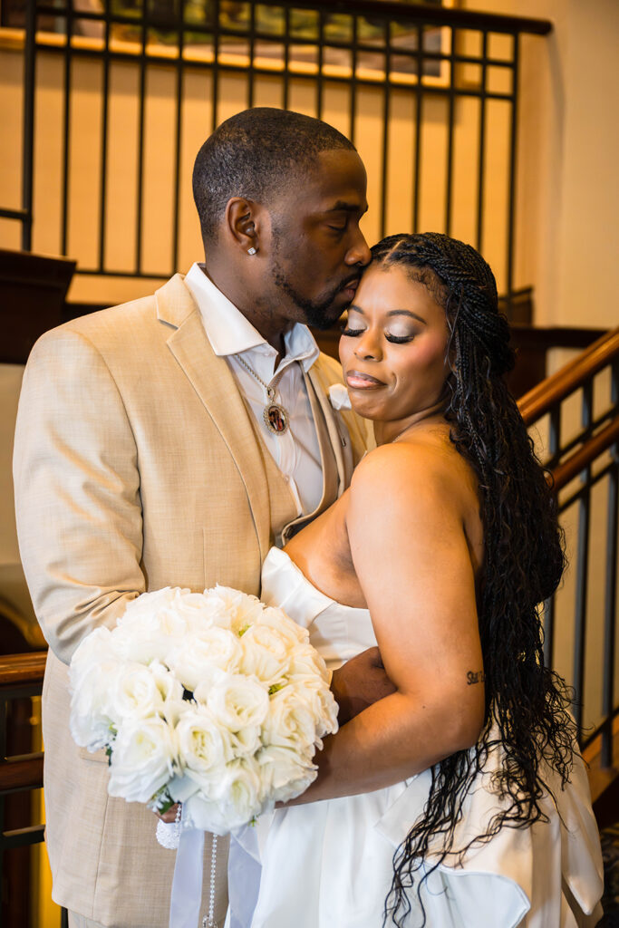 An elopement couples poses for an intimate photo for their Downtown Roanoke wedding.