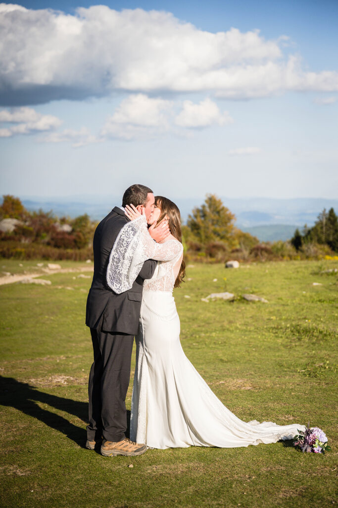 An elopement couple goes in for their first kiss at Grayson Highlands State Park.