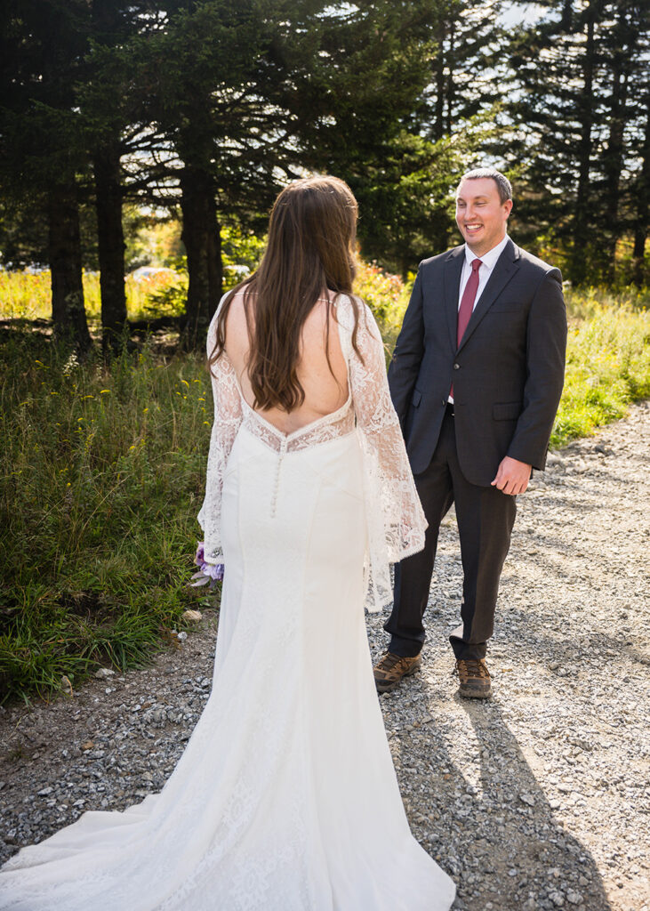 A marrier reacts warmly to seeing his significant other in a wedding dress.