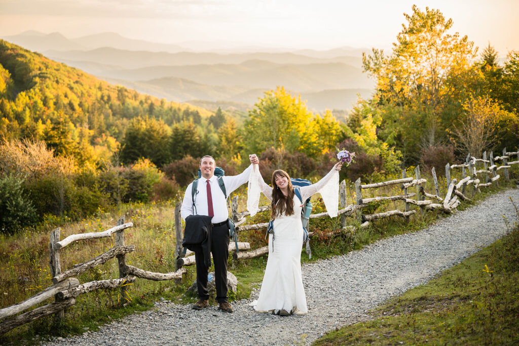An elopement wedding couple poses for a photo along the Massie Gap Trail in Grayson Highlands State Park in Virginia.