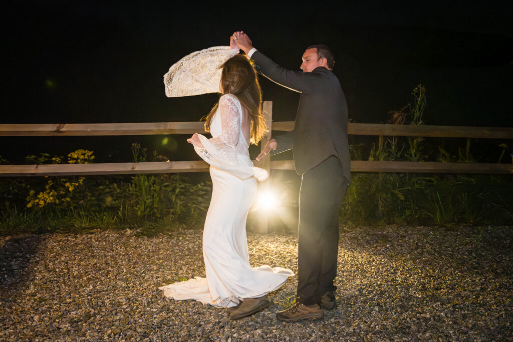 A wedding couple on their elopement day has their first dance at Highland Hideaways.