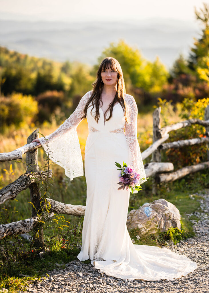 A bride poses for a photo along the Massie Gap trail on her elopement day.