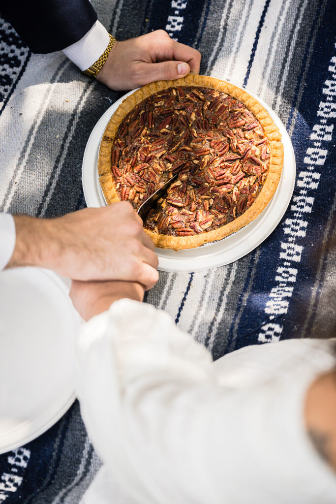 A couple cuts into a pecan pie together for their Grayson Highlands State Park elopement.