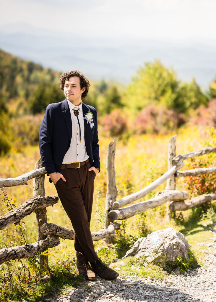 A groom poses along Massie Gap Trail.