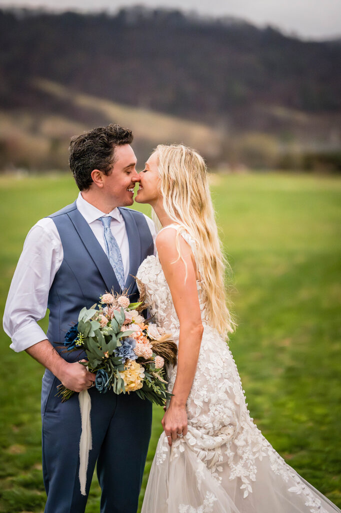 Two marriers go in for a kiss in Shenandoah, Virginia.