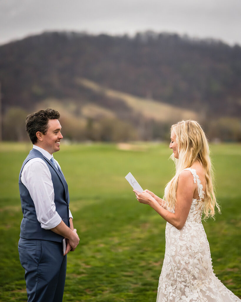 An elopement wedding couple read their private vows to one another in Sperryville, Virginia, just outside of Shenandoah National Park.