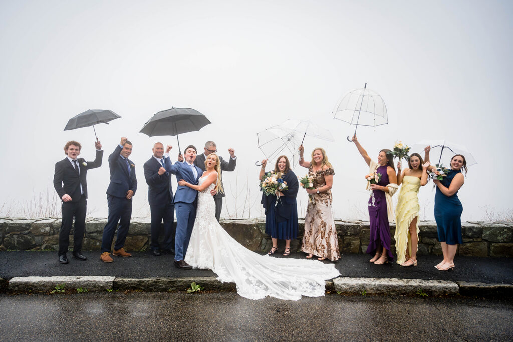A family cheers, hoots, and hollers after the bride and groom complete their ceremony at Thorofare Mountain Overlook in Shenandoah, Virginia.