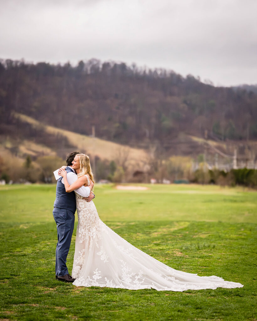 An elopement wedding couple embrace after reading their private vows to one another in Sperryville, Virginia, just outside of Shenandoah National Park.